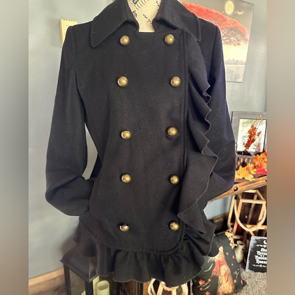 DKNY Wool coat with ruffled trim, pockets and oversized buttons.Size 2